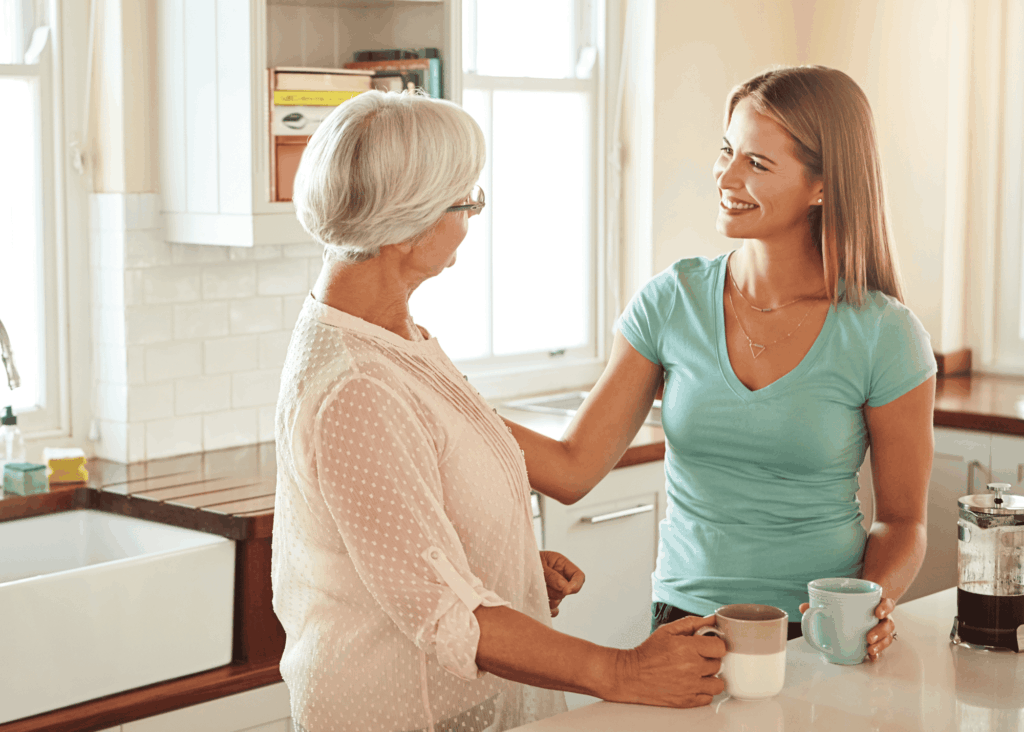 two women talking in a kitchen