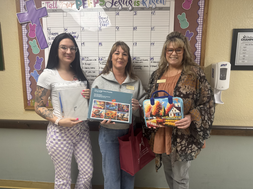 volunteers give memory care seniors activities